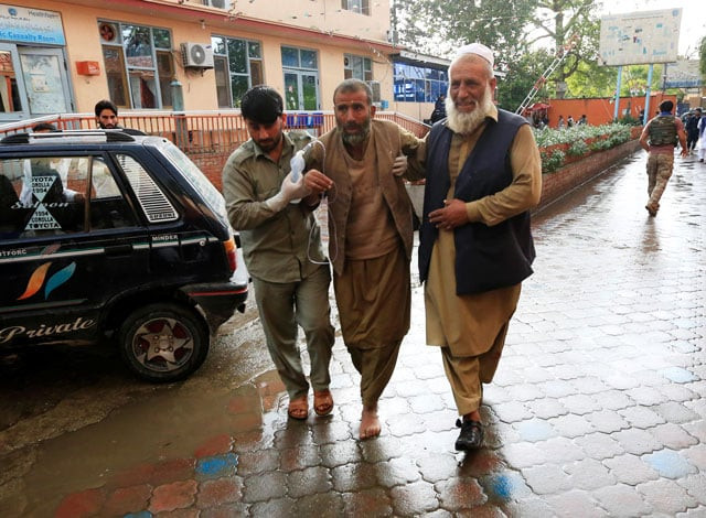men carry an injured person to a hospital after a bomb blast at a mosque in jalalabad afghanistan october 18 2019 photo reuters men carry an injured person to a hospital after a bomb blast at a mosque in jalalabad afghanistan october 18 2019 photo reuters