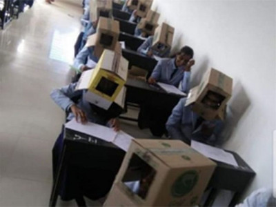 in bizarre way to stop cheating indian students forced to wear cartons on their heads