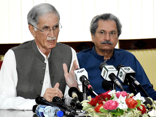 defence minister pervez khattak and education minister shafqat mehmood addressing a news conference in islamabad on saturday photo nni