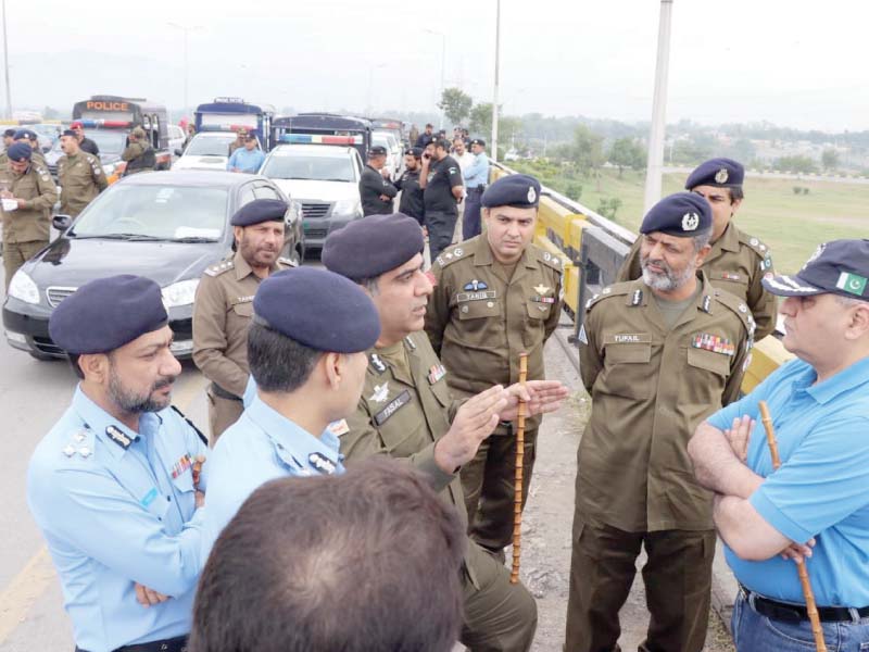 rawalpindi rpo ahsan tufail and islamabad ig amir zulfiqar exchange views on azadi march arrangements at faizabad photo express