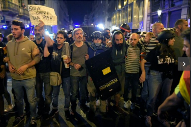 rotesters formed a human chain between police and a sit in as the tourist hotspot reels from days of clashes following the jailing of separatist leaders photo afp rotesters formed a human chain between police and a sit in as the tourist hotspot reels from days of clashes following the jailing of separatist leaders photo afp