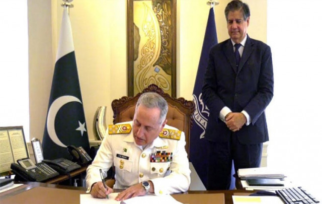 naval chief admiral zafar mahmood formally signs note of accession photo pn naval chief admiral zafar mahmood formally signs note of accession photo pn