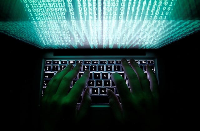 a man types on a computer keyboard in warsaw in this february 28 2013 photo reuters