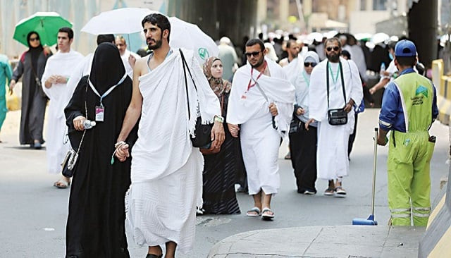 pilgrims walk on a street in makkah during the first day of hajj photo afp file pilgrims walk on a street in makkah during the first day of hajj photo afp file