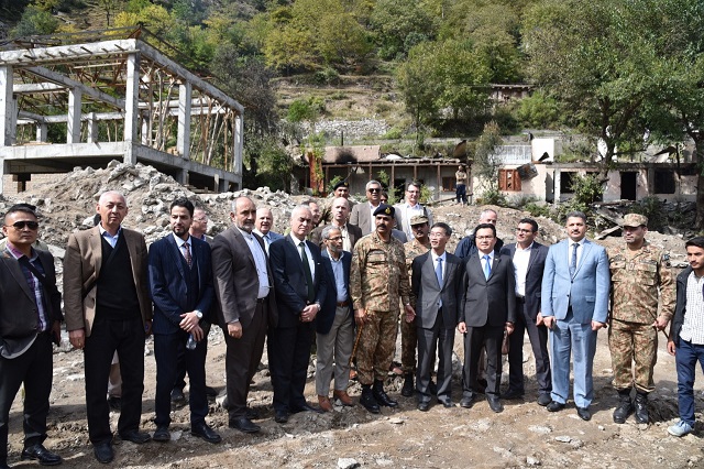 foreign diplomats and media personnel with ispr dg maj gen asif ghafoor during a tour of areas near the line of control photo express