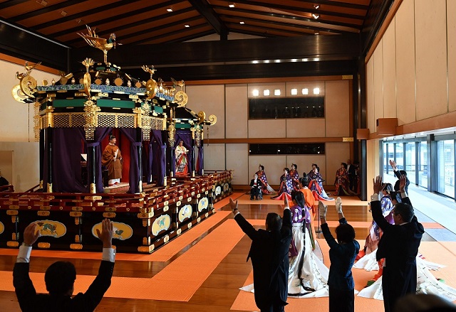 japanese officials shout banzai cheers for emperor naruhito during the enthronement ceremony photo afp
