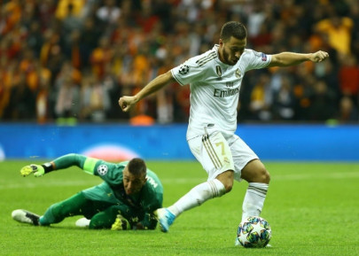 hazard pulls strings as real madrid edge galatasaray