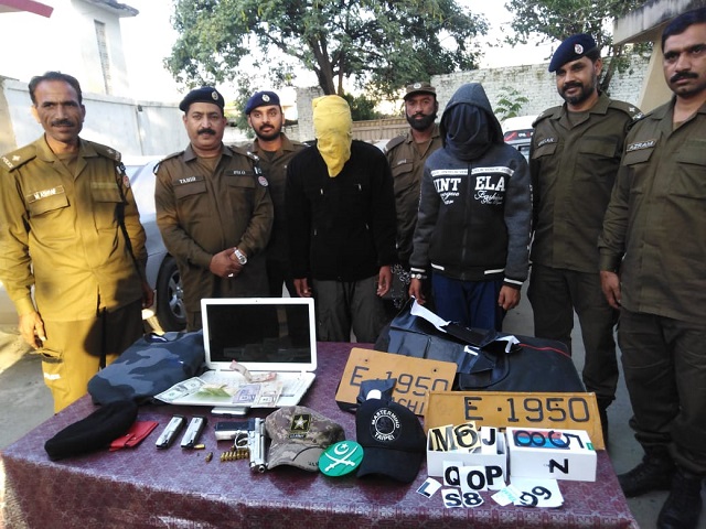 the suspects are photographed with police personnel while their belongings are also seen photo express