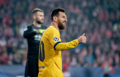 messi s historic goal helps barcelona edge slavia prague