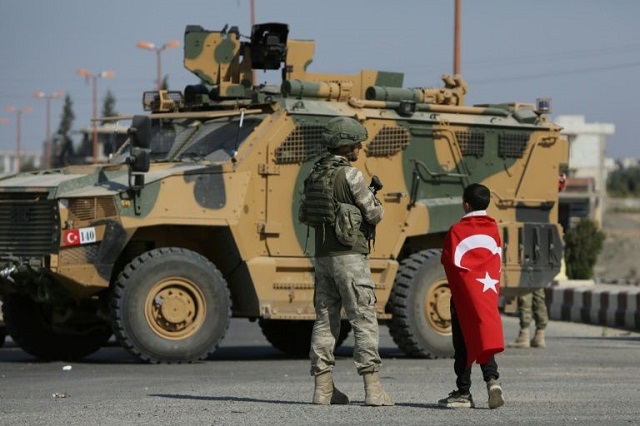 turkish soldiers patrol the syrian border town of tal abyad part of an arab majority strip along the frontier where ankara will retain full control under the deal reached with moscow photo afp