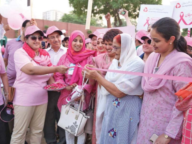shah sultan pirani a cancer survivor aged above 80 cuts the ribbon to commence the pink walk organised by aku to raise awareness about the importance of regular screening for breast cancer photo express shah sultan pirani a cancer survivor aged above 80 cuts the ribbon to commence the pink walk organised by aku to raise awareness about the importance of regular screening for breast cancer photo express