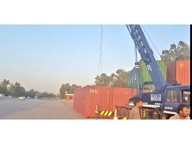 district administration has placed containers near islamabad toll plaza photo express district administration has placed containers near islamabad toll plaza photo express