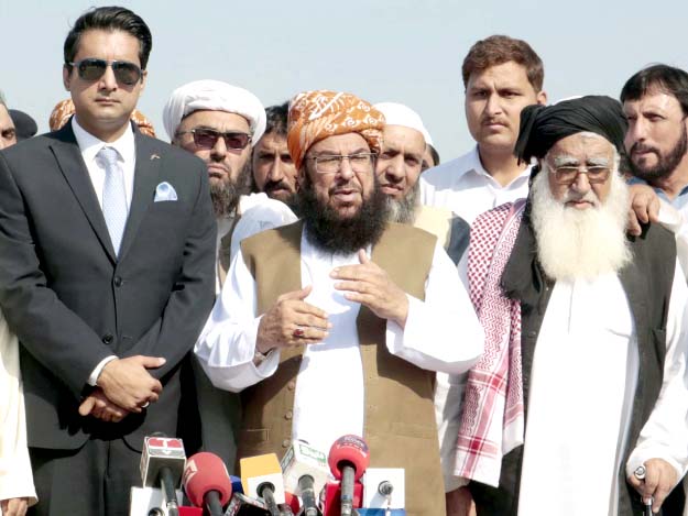 jui f secretary general abdul ghafoor haideri and dc hamza shafqaat talk to the media the area the government has allocated for the azadi march photos ppi express