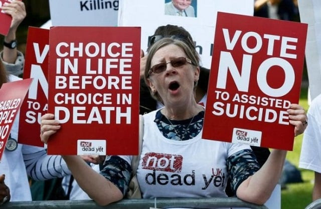 file photo of a demonstrator against assisted suicide in a protest outside parliament in london sept 11 2015 photo reuters file photo of a demonstrator against assisted suicide in a protest outside parliament in london sept 11 2015 photo reuters