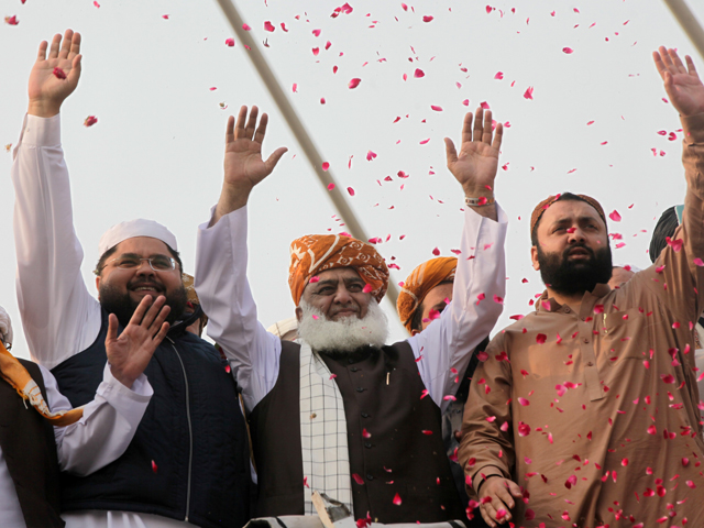 maulana fazalur rehman waves to supporters in lahore on october 30 2019 photo reuters