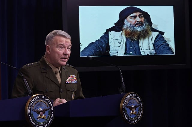 us marine corps gen kenneth mckenzie commander of us central command speaks as a picture of abu bakr al baghdadi is seen during a press briefing photo afp