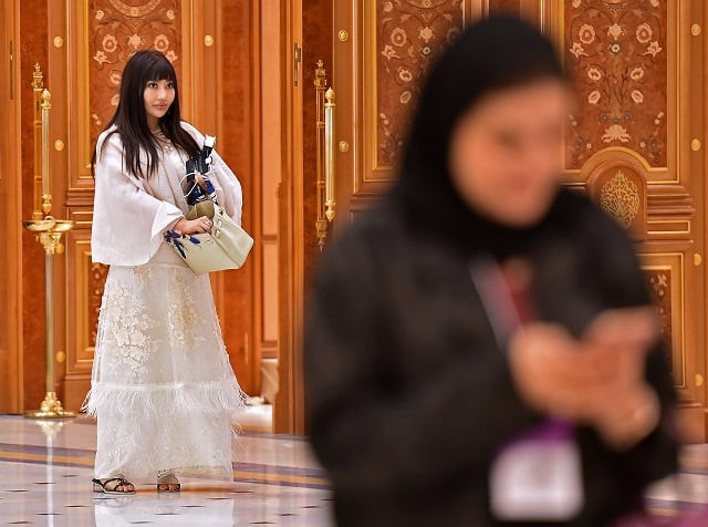 a picture taken on october 31 2019 shows a foreign woman wearing an embroidered tunic during the future investment initiative fii forum at the king abdulaziz conference centre in capital city riyadh photo afp a picture taken on october 31 2019 shows a foreign woman wearing an embroidered tunic during the future investment initiative fii forum at the king abdulaziz conference centre in capital city riyadh photo afp