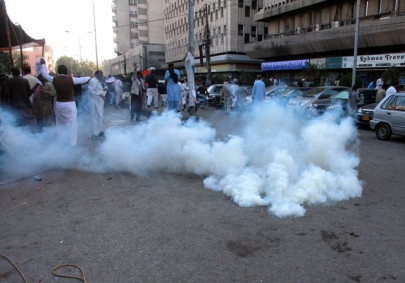 students faint from tear gas shelling at nearby police training centre in sindh