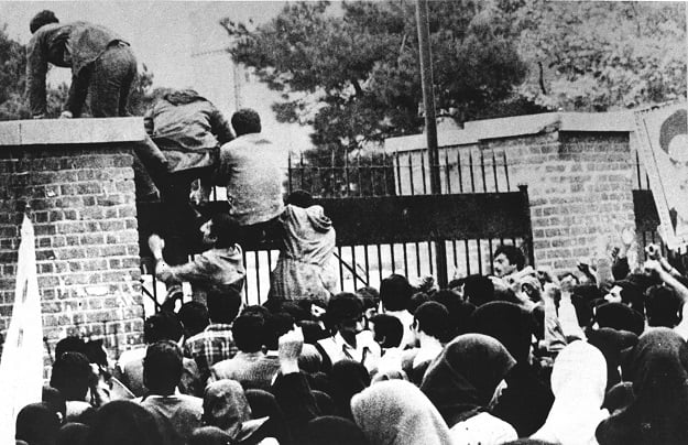 a file photo taken on november 04 1979 shows iranian revolutionary students climbing the us embassy 039 s gate in tehran photo afp