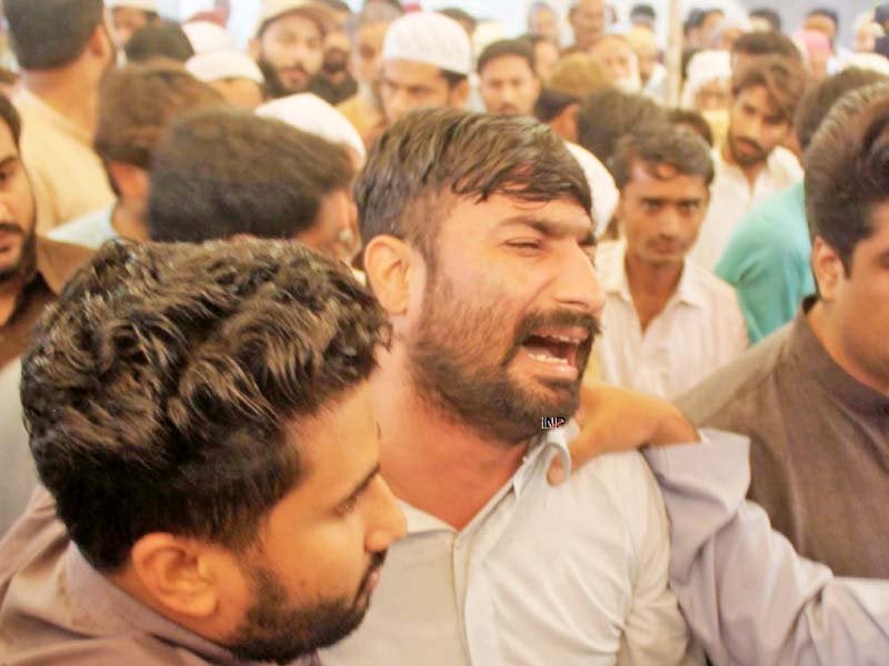 mirpurkhas and umerkot districts were in a state of mourning on friday as 13 people who lost their lives in the fire incident in tezgam express were laid to rest photos afp ppi online inp