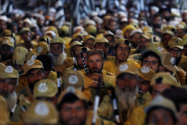 supporters of opposition parties listen to the speeches of their leaders during the azadi march photo reuters