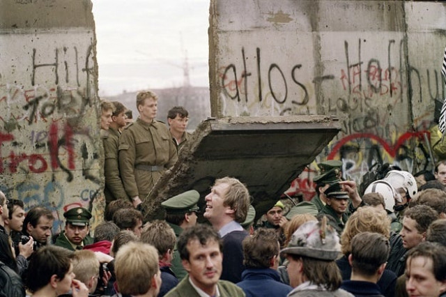 in this file photo taken on november 11 1989 west berliners crowd in front of the berlin wall early as they watch east german border guards demolishing a section of the wall in order to open a new crossing point between east and west berlin near the potsdamer square in berlin photo afp in this file photo taken on november 11 1989 west berliners crowd in front of the berlin wall early as they watch east german border guards demolishing a section of the wall in order to open a new crossing point between east and west berlin near the potsdamer square in berlin photo afp