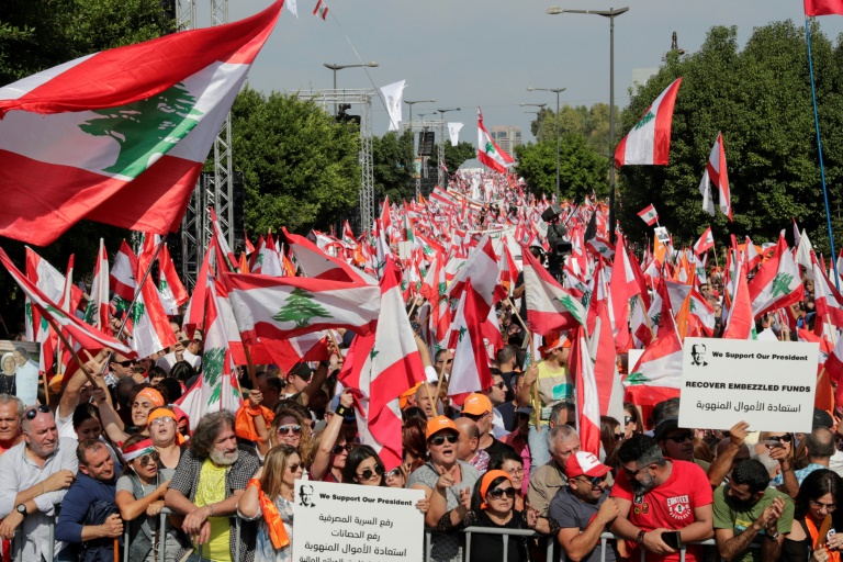 supporters of lebanese president michel aoun pack the streets around the presidential palace ahead of a counter demonstration by protesters demanding a complete overhaul of a political system deemed corrupt photo afp