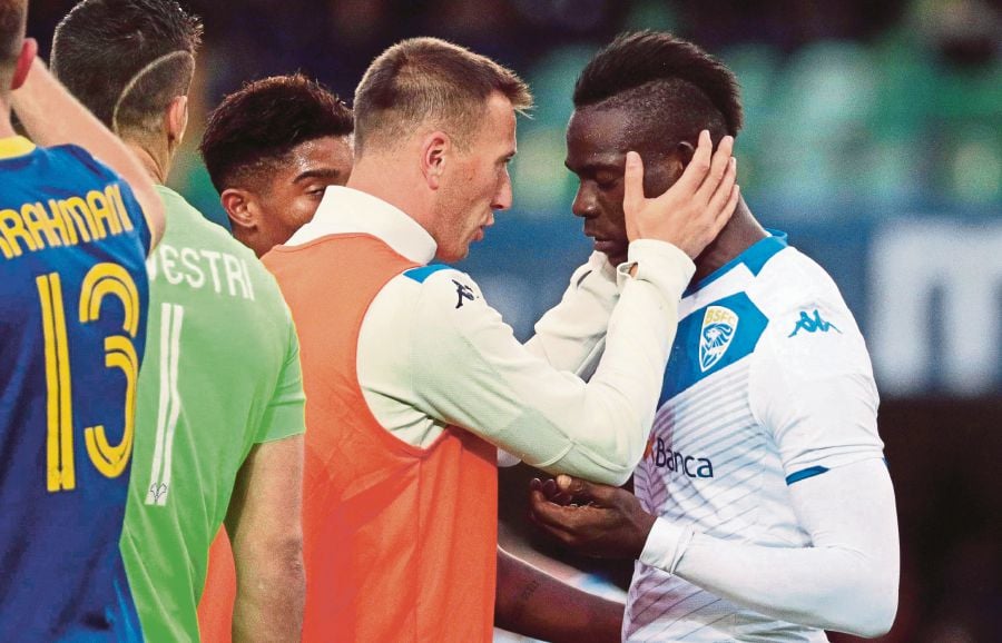 29 year old had to be held back by players from both teams to stop him from leaving the field of play photo afp