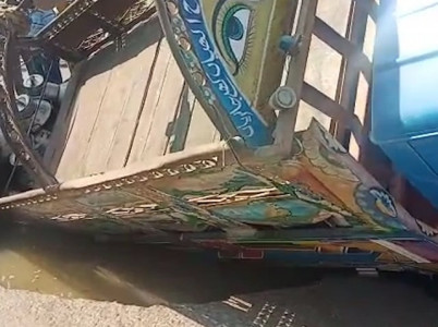 watch truck topples over as part of karachi s club road caves in
