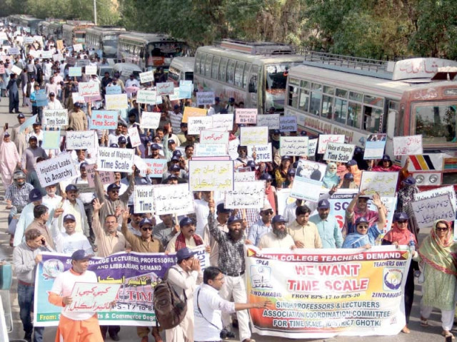 scores of teachers of government colleges from across sindh staged a sit in outside the chief minister cm house demanding they be promoted on the basis of the time scale photo online scores of teachers of government colleges from across sindh staged a sit in outside the chief minister cm house demanding they be promoted on the basis of the time scale photo online