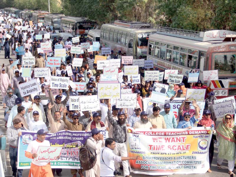 scores of teachers of government colleges from across sindh staged a sit in outside the chief minister cm house demanding they be promoted on the basis of the time scale photo online