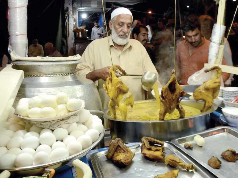 a vendor prepares chicken and egg soup popularly known as yakhni local at his food stall in rawalpindi photo inp