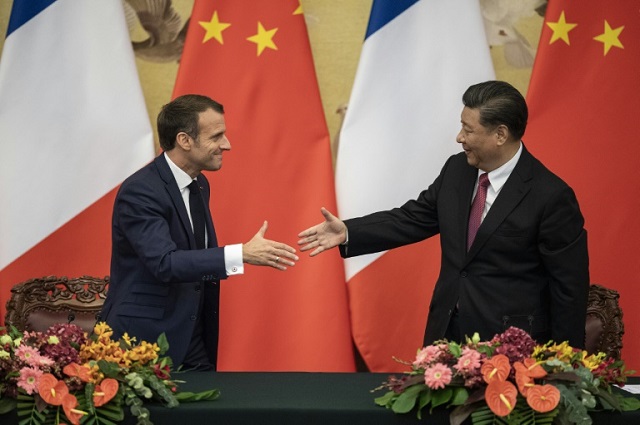 french president emmanuel macron and chinese leader xi jinping put on a united front on the paris climate accord after washington pulled out photo afp