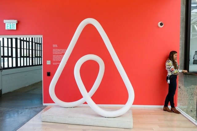 a woman talks on the phone at the airbnb office headquarters in the soma district of san francisco california us august 2 2016 photo reuters