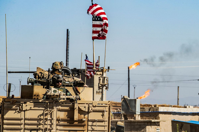 a us military armored vehicle drives in a patrol past an oil well in rumaylan in syria s northeastern hasakeh province on november 6 2019 photo afp a us military armored vehicle drives in a patrol past an oil well in rumaylan in syria s northeastern hasakeh province on november 6 2019 photo afp
