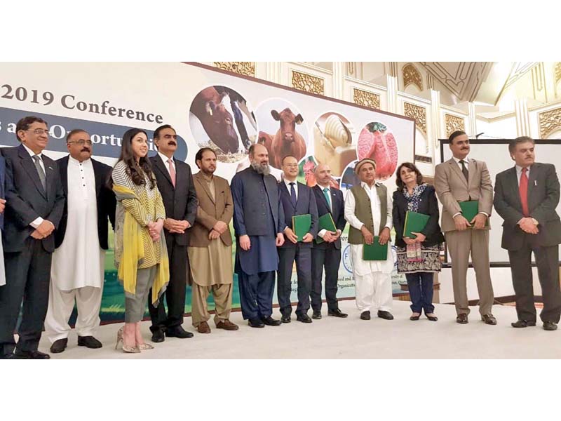 balochistan chief minister jam kamal poses for picture along with participants of livestock seminar photo express