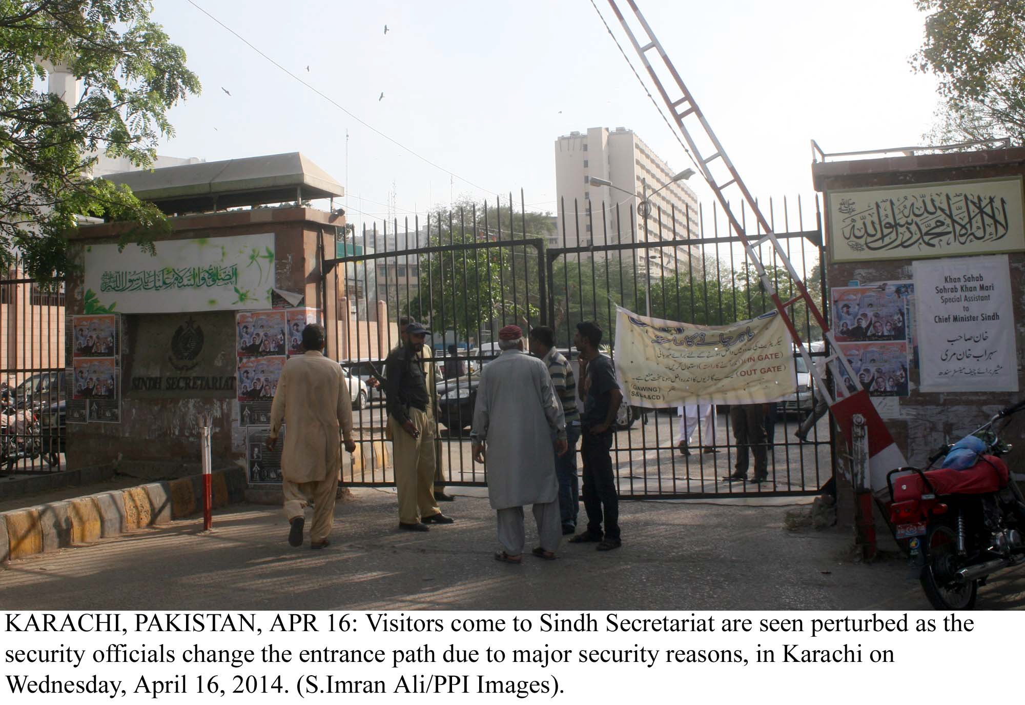 police and security officials stop people from entering the sindh secretariat after it was closed for public on wednesday photo ppi file