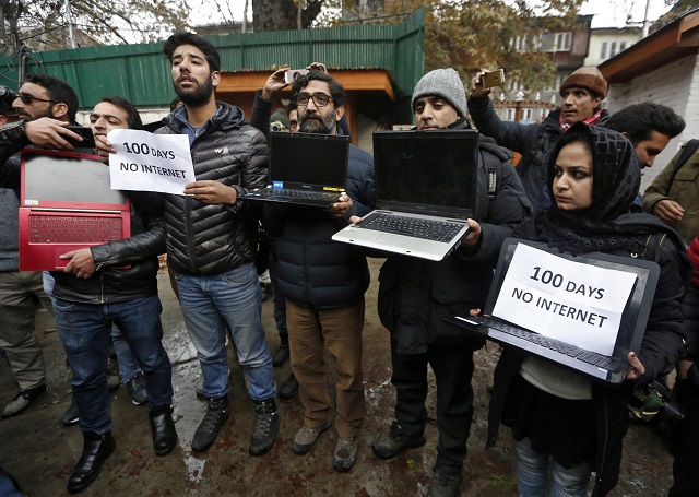 kashmiri journalists display laptops and placards during a protest demanding restoration of internet service in srinagar photo reuters