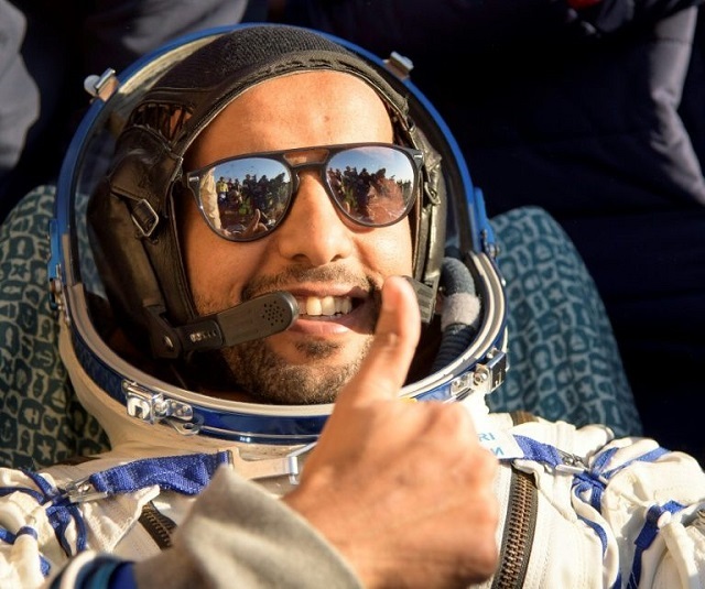 united arab emirates astronaut hazzaa al mansoori gives a thumbs up shortly after the landing of the russian soyuz ms 12 space capsule on october 3 2019 photo afp