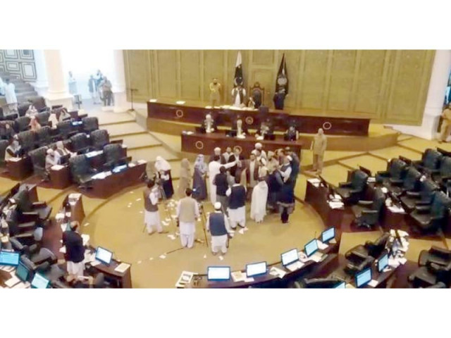 opposition members tear up copies of the agenda as they protest in the k p assembly photo express opposition members tear up copies of the agenda as they protest in the k p assembly photo express