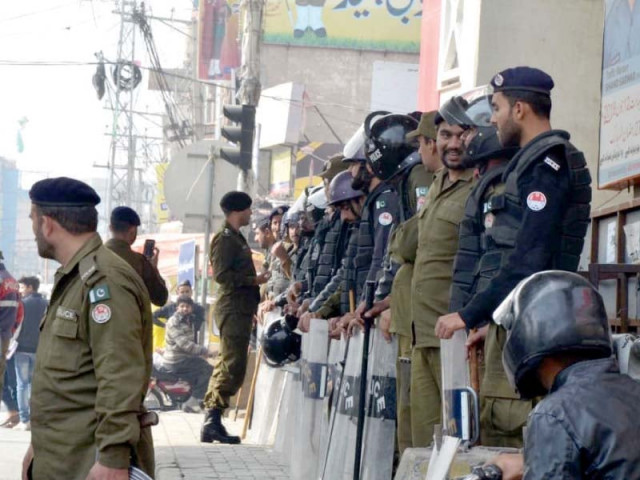 police in riot gear stand at chandni chowk on wednesday photo express police in riot gear stand at chandni chowk on wednesday photo express