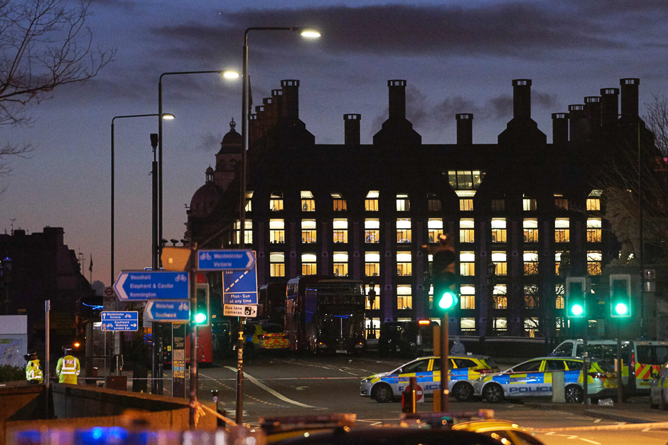 British police officers work on Westminster Bridge, adjacent to the Houses of Parliament in Westminster, central London in the aftermath of a terror incident. PHOTO: AFP