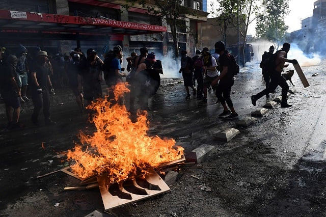 demonstrators clash with riot police during a protest against the government photo afp