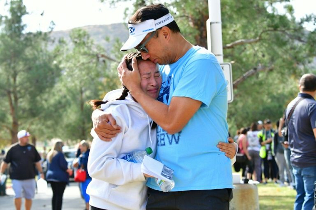 a man embraces his daughter after a shooting at saugus high school in santa clarita california photo afp a man embraces his daughter after a shooting at saugus high school in santa clarita california photo afp