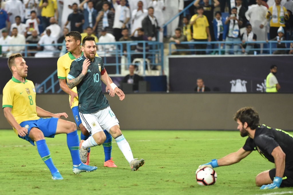 heated exchange messi looked to the touchline and put his fingers to his lips before making another hand sign that appeared to tell the brazil coach he had too much to say for himself photo afp