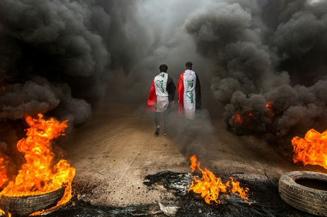 anti government protesters set tyres on fire to block roads in iraq 039 s southern city of basra photo afp anti government protesters set tyres on fire to block roads in iraq 039 s southern city of basra photo afp