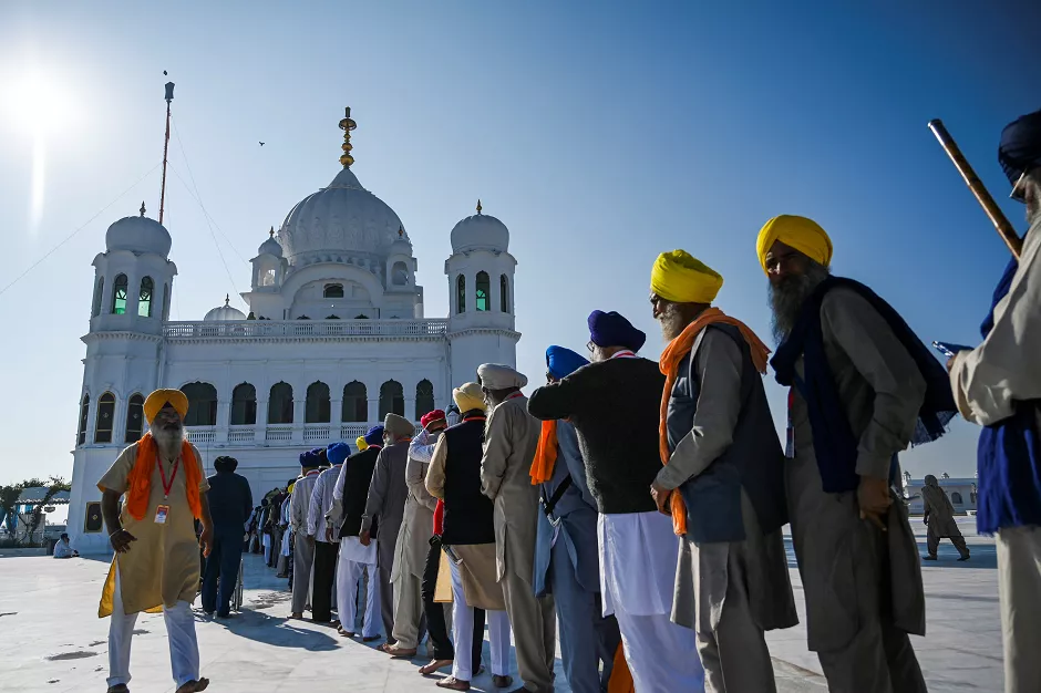 sikh pilgrims stand in a queue to visit the shrine of baba guru nanak dev at gurdwara darbar sahib in kartarpur on november 9 2019 photo afp sikh pilgrims stand in a queue to visit the shrine of baba guru nanak dev at gurdwara darbar sahib in kartarpur on november 9 2019 photo afp