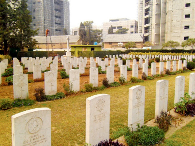 neatly lined graves of soldiers in the war cemetery corner top an insignia on a tombstone left and weed thick area of the graveyard photo express neatly lined graves of soldiers in the war cemetery corner top an insignia on a tombstone left and weed thick area of the graveyard photo express