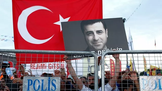 a supporter of turkey 039 s main pro kurdish peoples 039 democratic party holds a portrait of their jailed former leader and presidential candidate selahattin demirta during a campaign event in istanbul turkey photo reuters file a supporter of turkey 039 s main pro kurdish peoples 039 democratic party holds a portrait of their jailed former leader and presidential candidate selahattin demirta during a campaign event in istanbul turkey photo reuters file