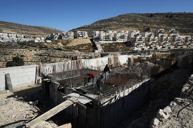 labourers work in a construction site in the israeli settlement of ramat givat zeev in the occupied west bank photo reuters